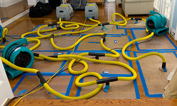 Professional Water Damage Restoration technician working in Waukau, WI